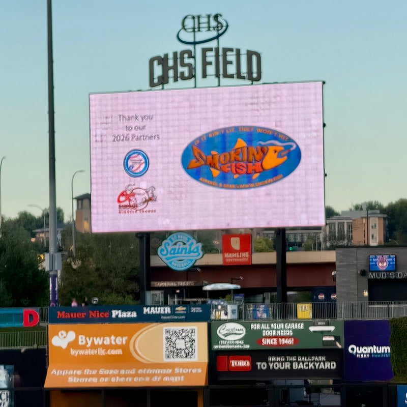 Smokin’ Fish® made the scoreboard at CHS field in Saint Paul during Sigars & Baseball.