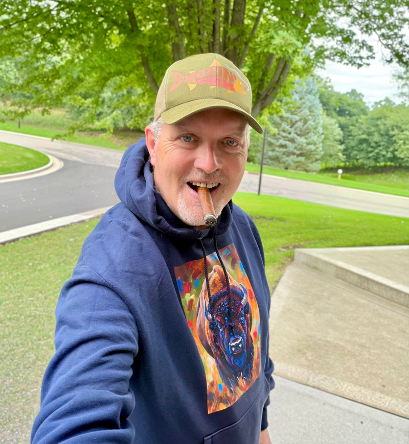 Farls sports his Smokin’ Fish® cap with his custom-made Anthony Kosobud Photography & Art Sweatshirt prior to heading out to chase some smallies on the fly. (https://www.anthonykosobudphotography.com)